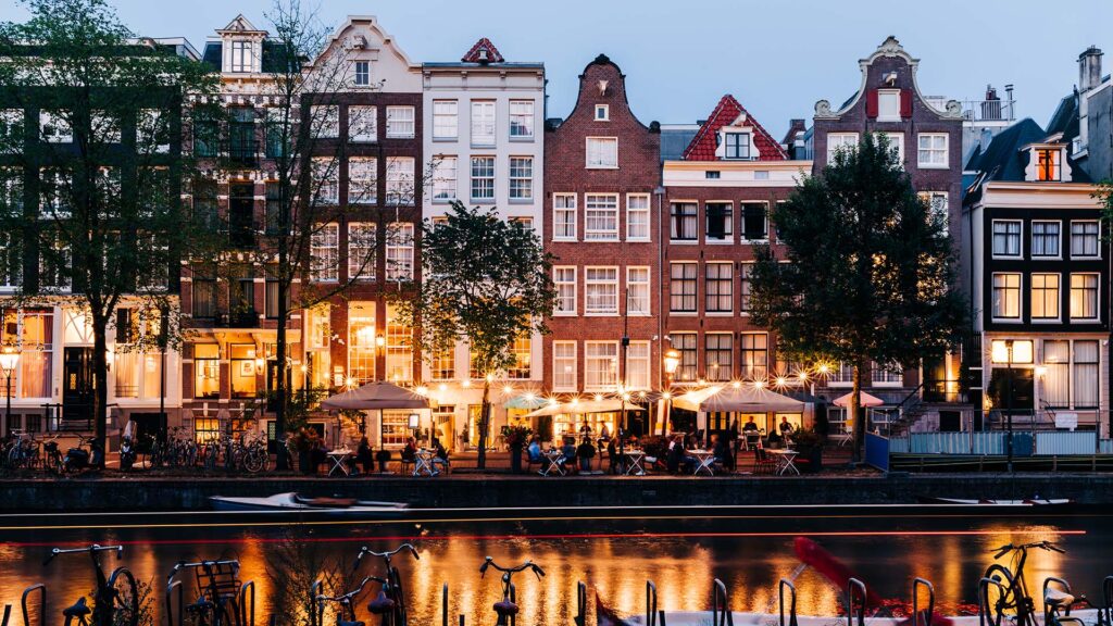 beautiful buildings along a river in Amsterdam, Netherlands
