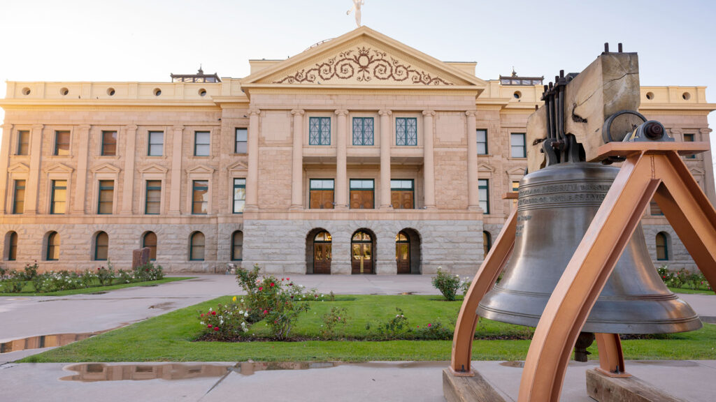 Arizona Capitol Museum building with a large bell out front.