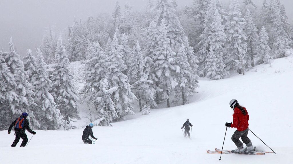 four people skiing in Mont-Tremblant, Canada