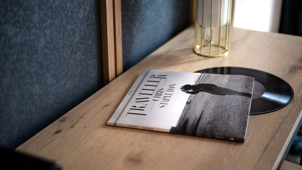 a record sits atop a table at The Otis Hotel Austin, Autograph Collection